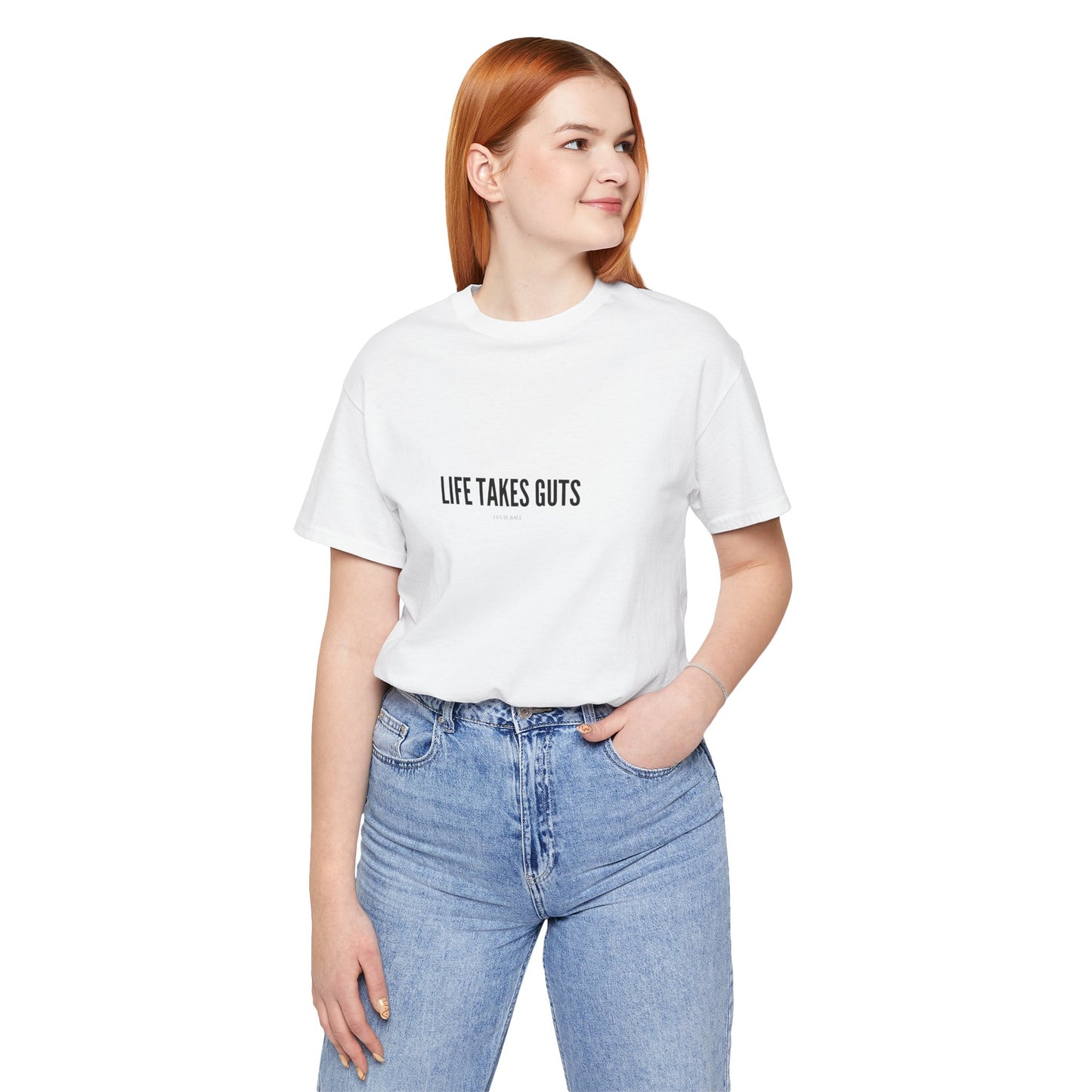Person wearing a white t-shirt with 'LIFE TAKES GUTS' text on a white background