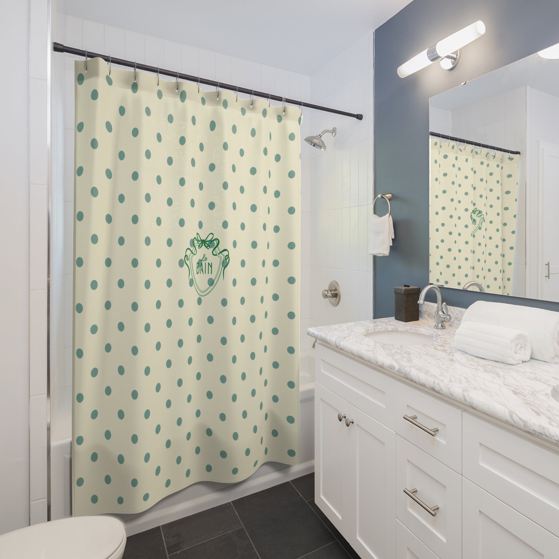 Bathroom with a polka dot shower curtain and white vanity.