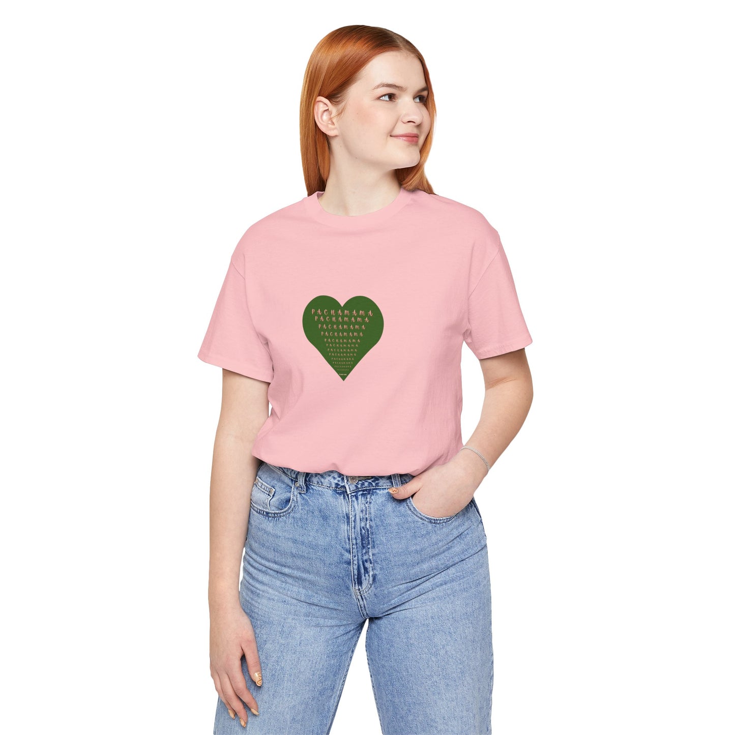 Person wearing a pink t-shirt with a green heart design on a white background