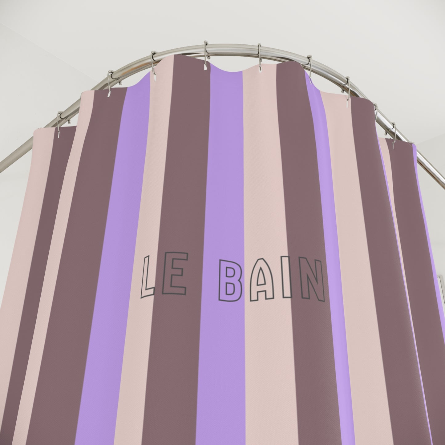 Striped shower curtain with 'LE BAIN' text on a white background