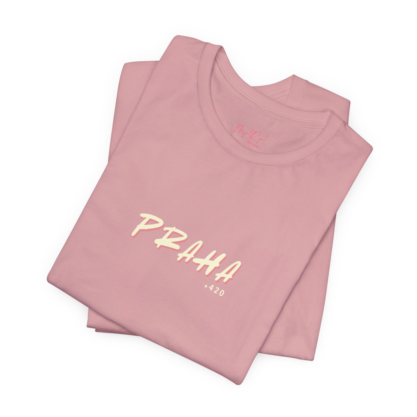 Folded pink t-shirt with 'PRAHA +420' text on a white background
