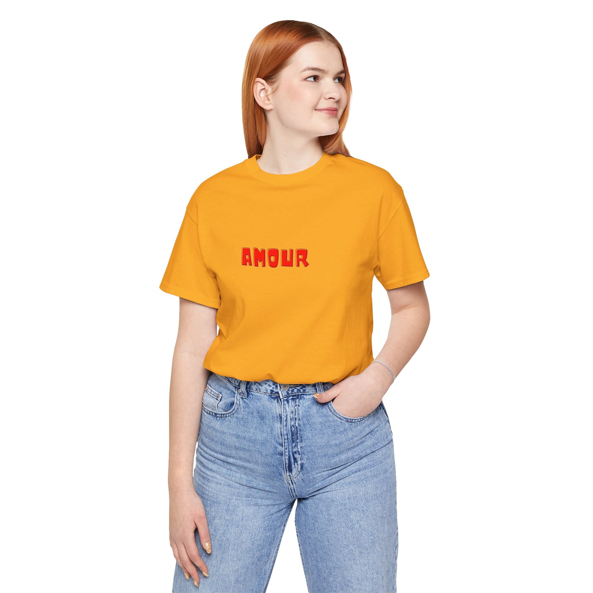 Person wearing a yellow t-shirt with 'AMOUR' printed on it against a white background