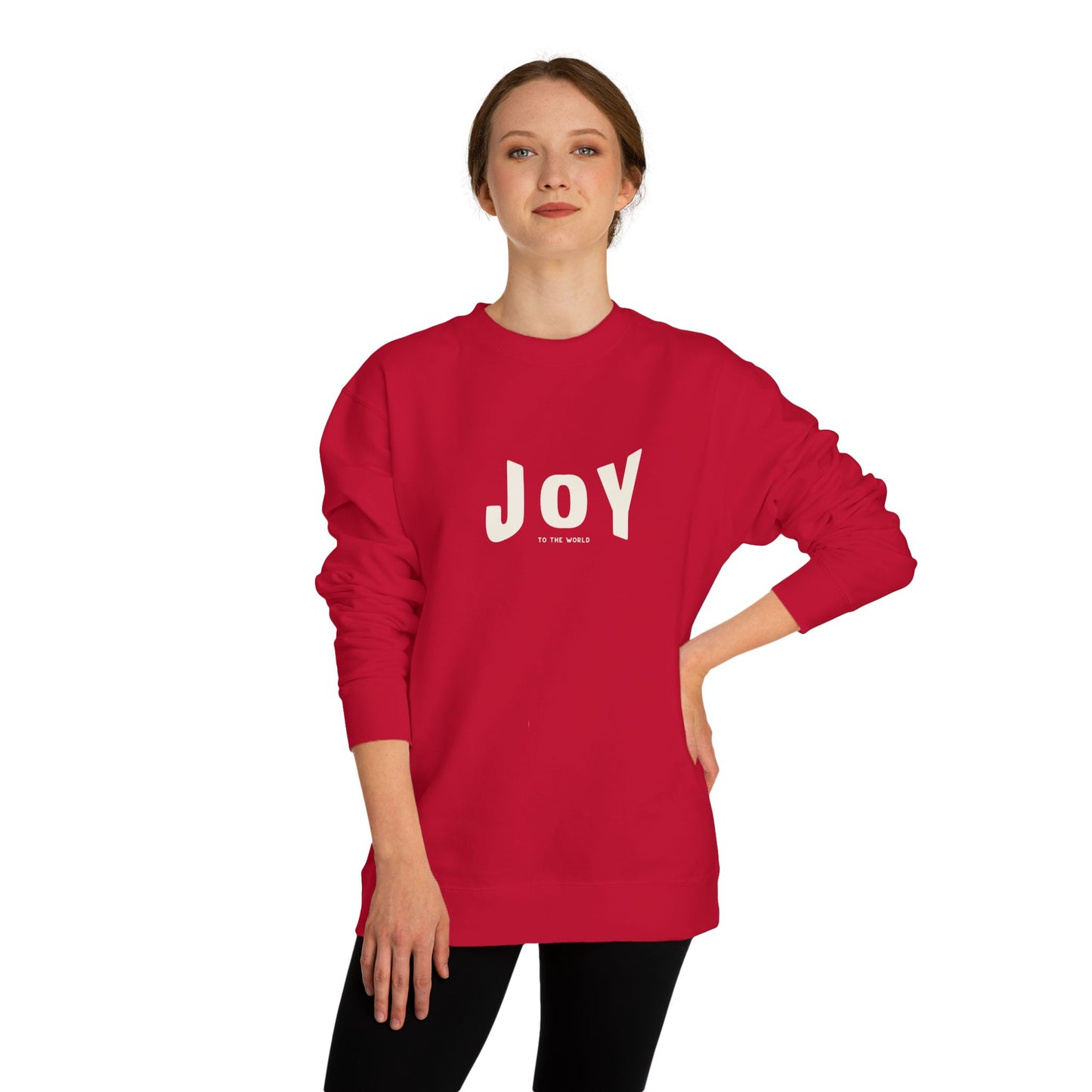 Person wearing a red sweatshirt with 'JOY' printed on it against a white background