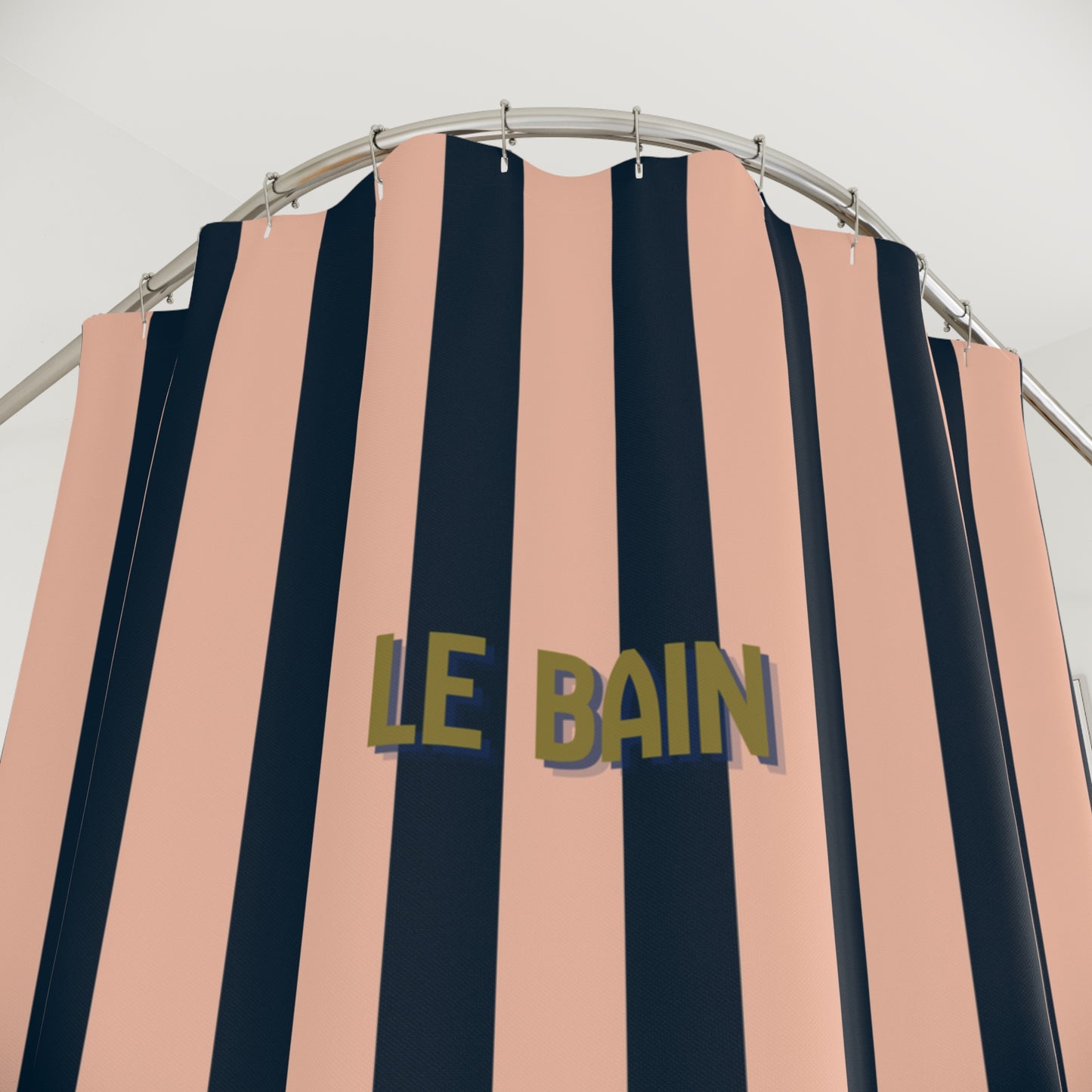 Striped shower curtain with 'LE BAIN' text on a white background