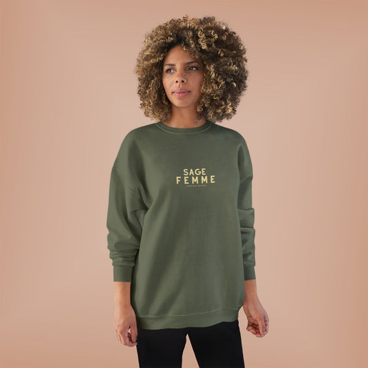 Woman wearing a green sweatshirt with 'SAGE FEMME' text on a beige background
