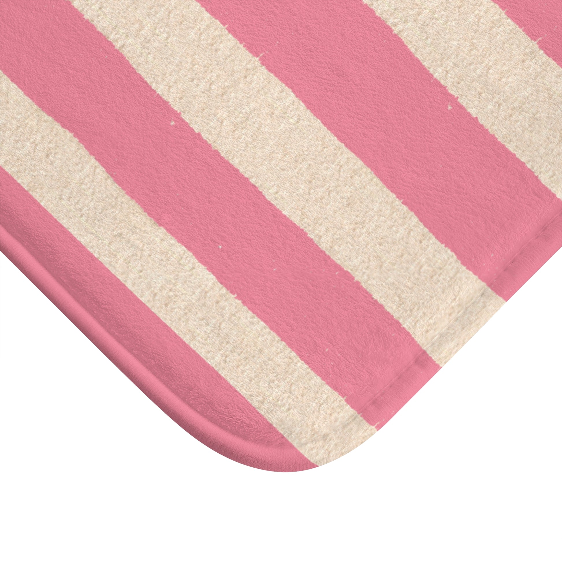 Close-up of a pink and beige striped fabric texture