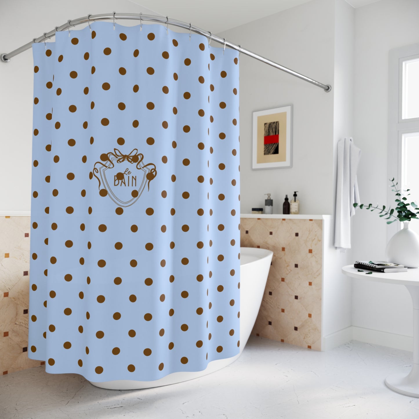 Blue shower curtain with brown polka dots in a bathroom setting