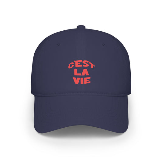 Navy blue cap with red text 'Cést La Vie' on a white background