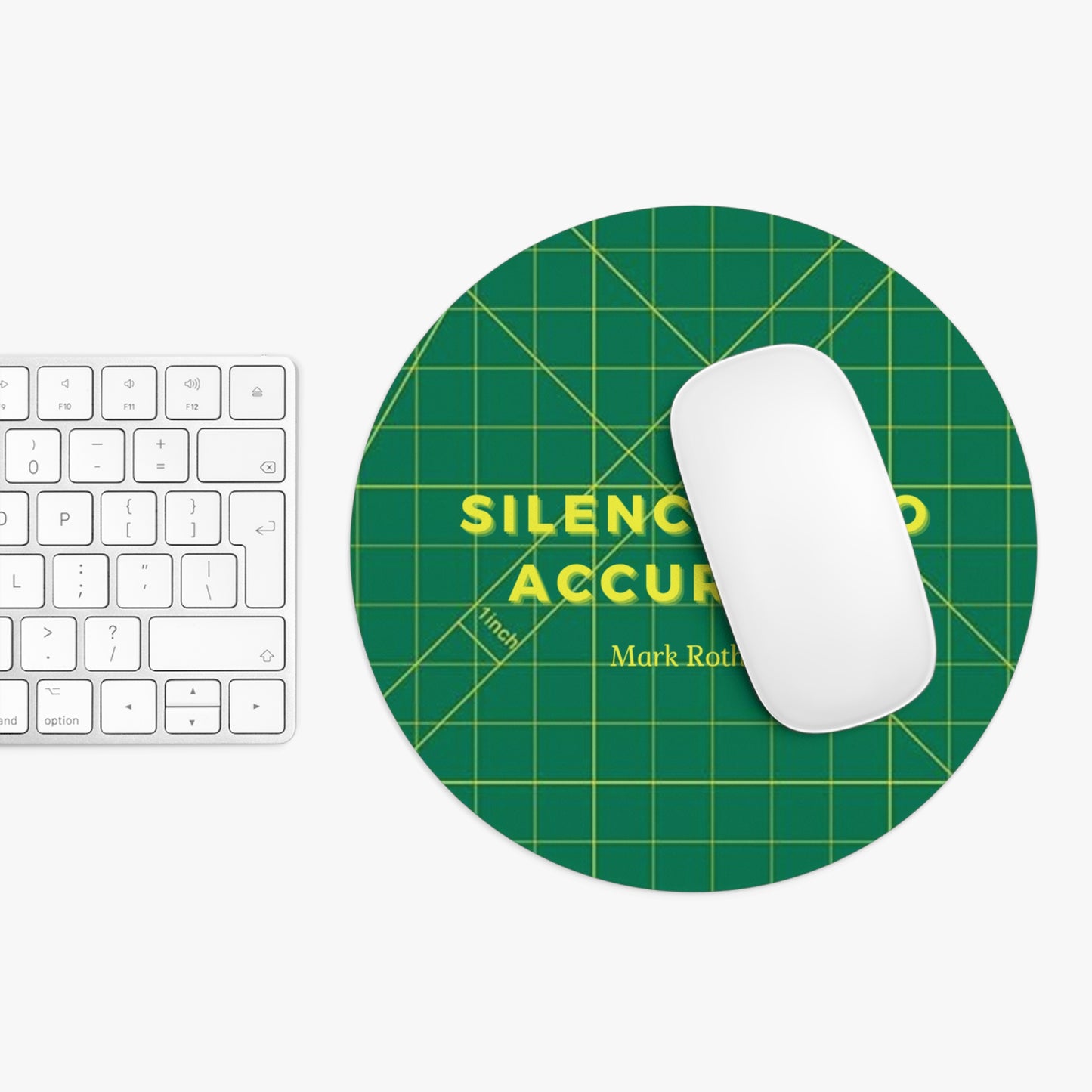 Green mouse pad with yellow text on a white surface with a keyboard and mouse.