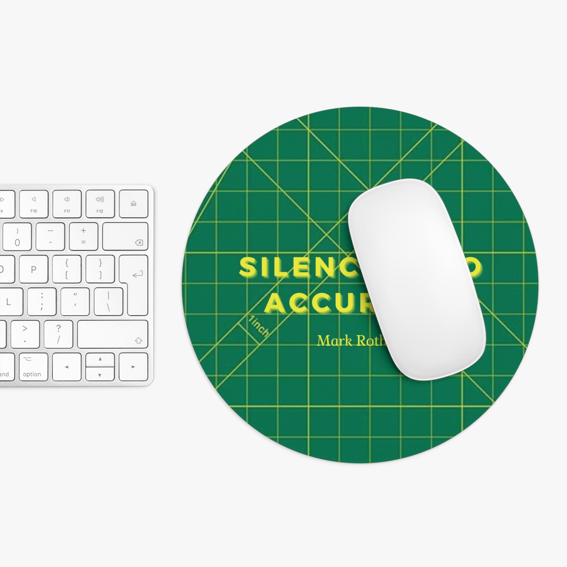 Green mouse pad with yellow text on a white surface with a keyboard and mouse.