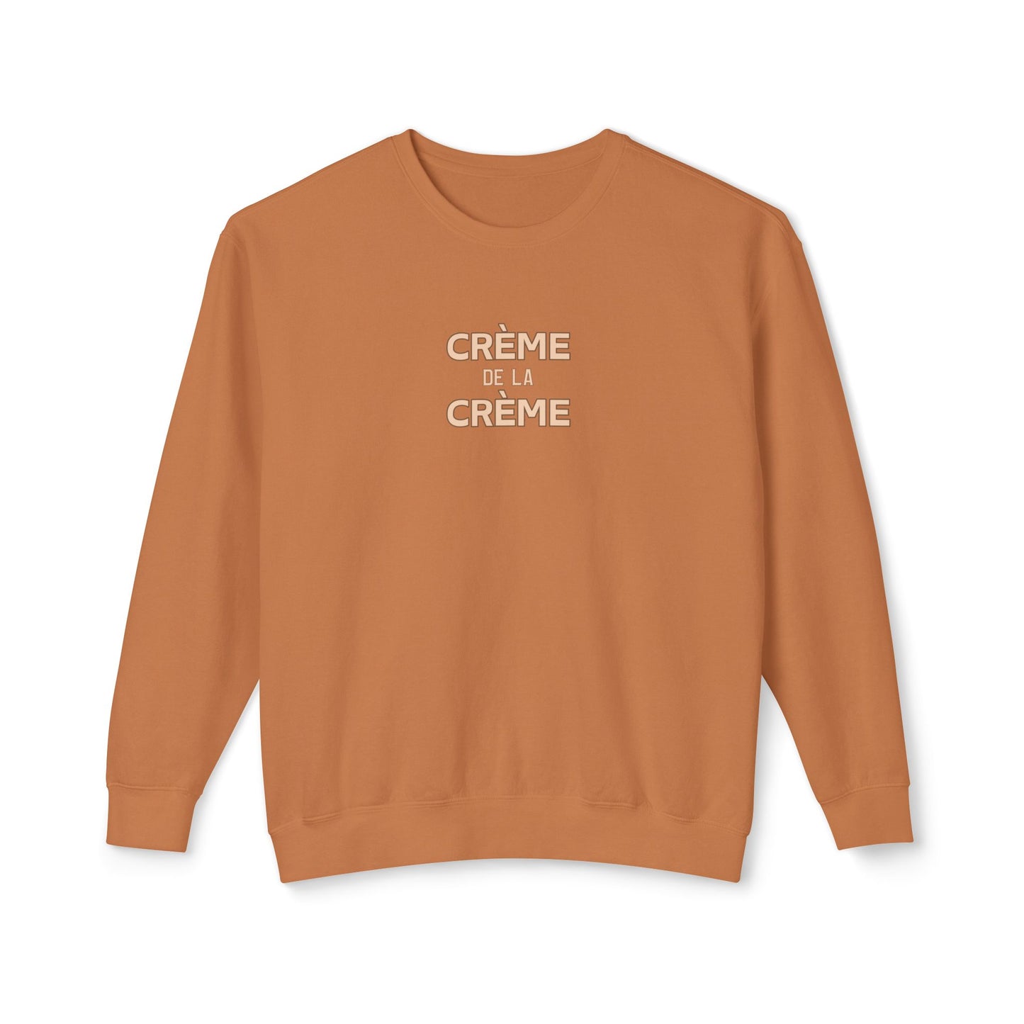 Brown sweatshirt with 'Crème de la Crème' text on a white background