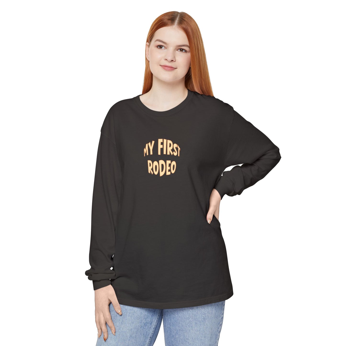 Woman wearing a black long-sleeve shirt with 'My First Rodeo' text on a white background