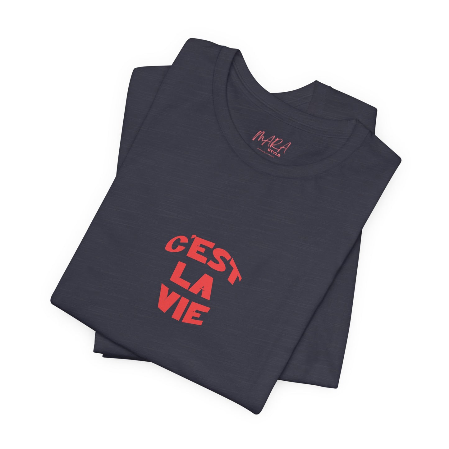 Folded navy blue t-shirt with red text 'C'est La Vie' on a white background