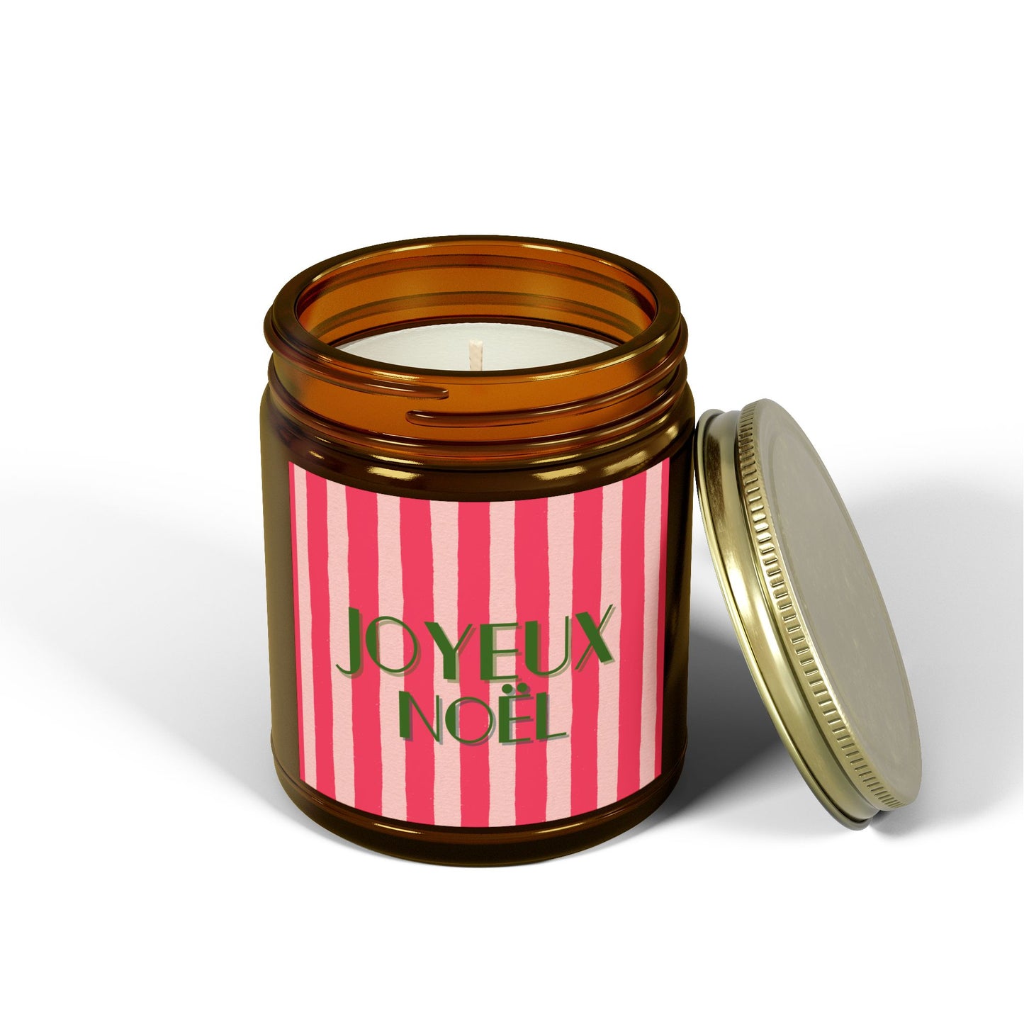 Candle in a jar with 'Joyeux Noel' label on a white background