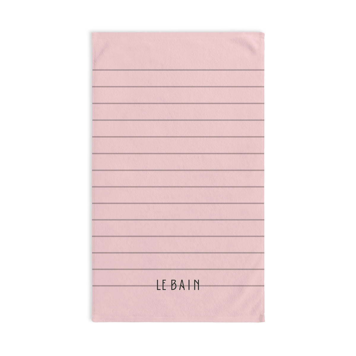 A rectangular pink towel with horizontal gray lines and the text 'LE BAIN' printed in black at the bottom, shown on a plain white background.