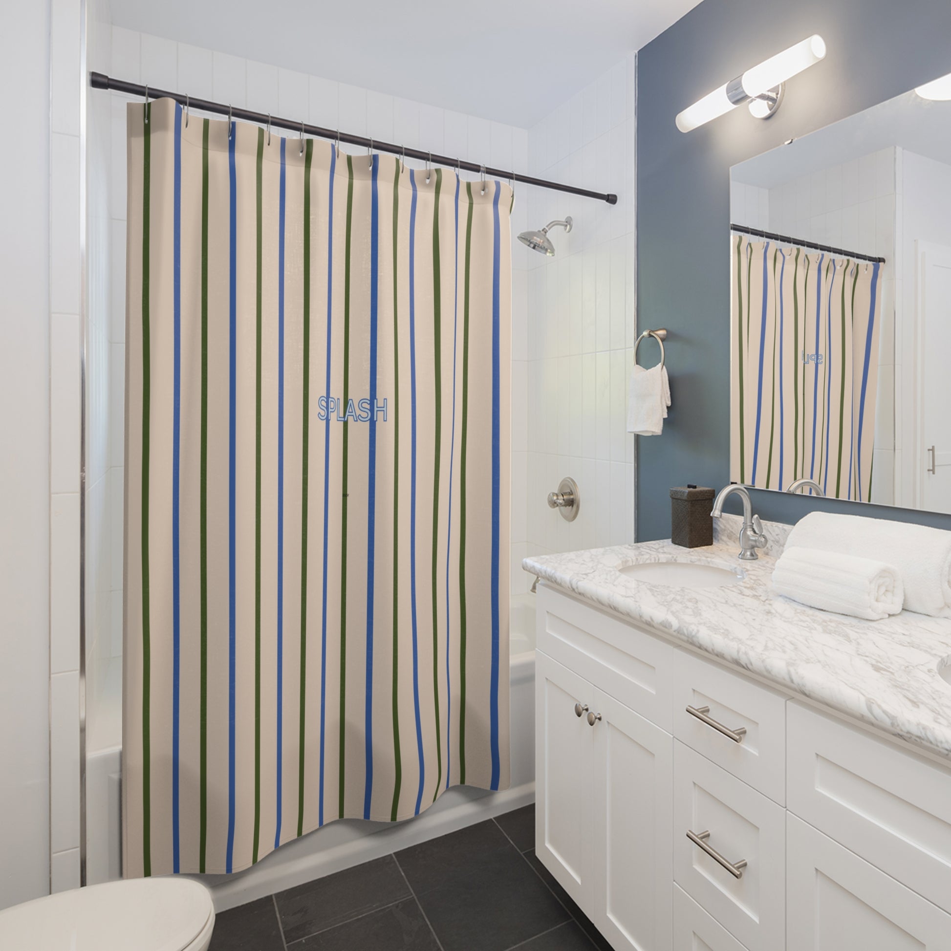 Bathroom with a patterned shower curtain, white vanity, and mirror.