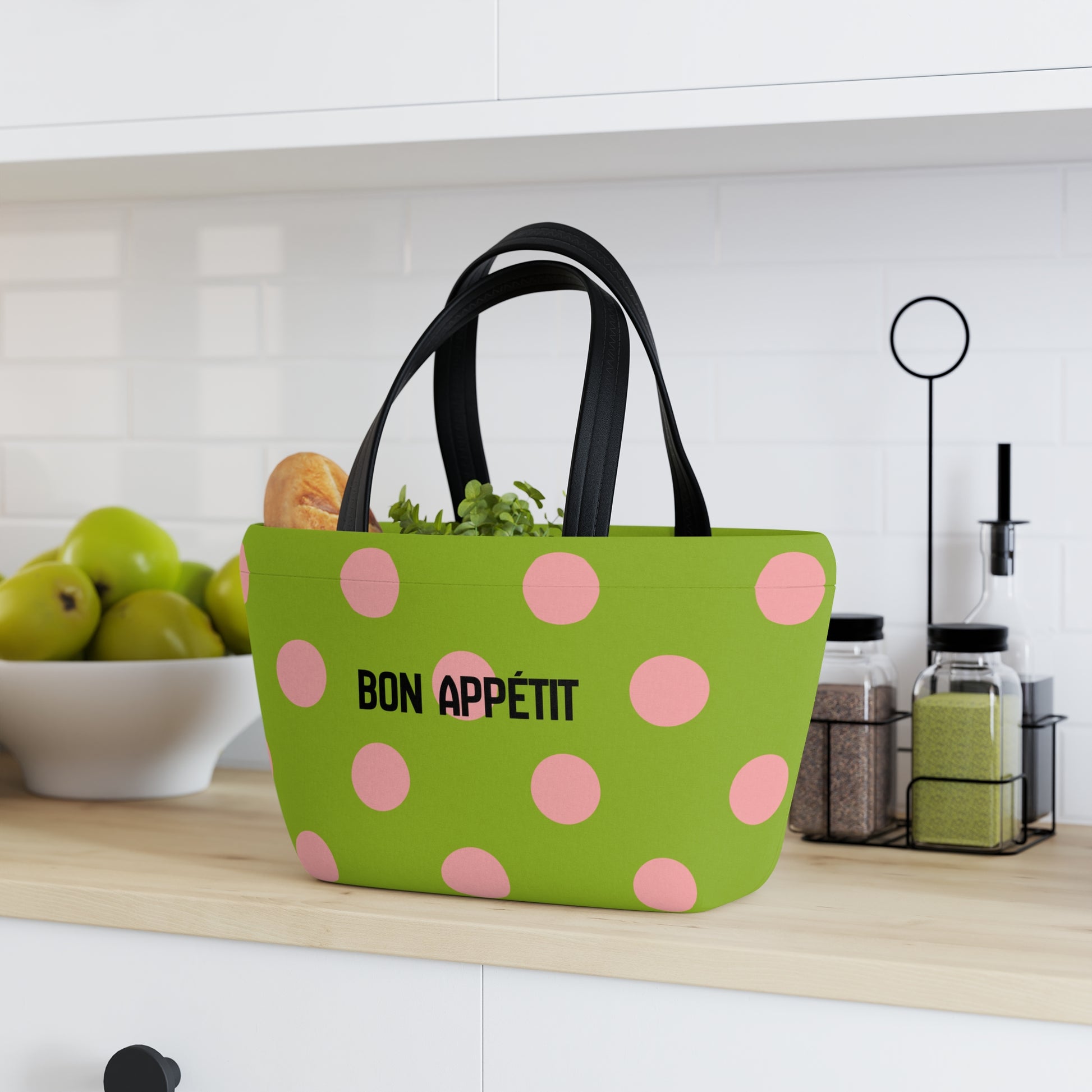 Green polka dot bag with 'Bon Appetit' text on a kitchen counter