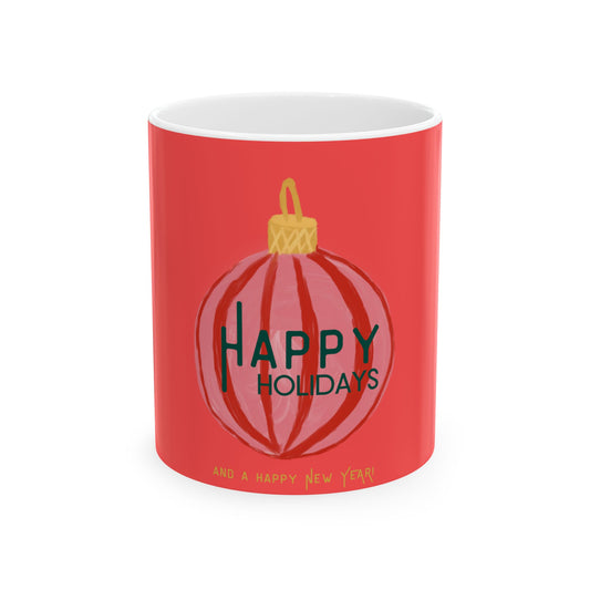 Red mug with a Christmas ball design and 'Happy Holidays' text on a white background