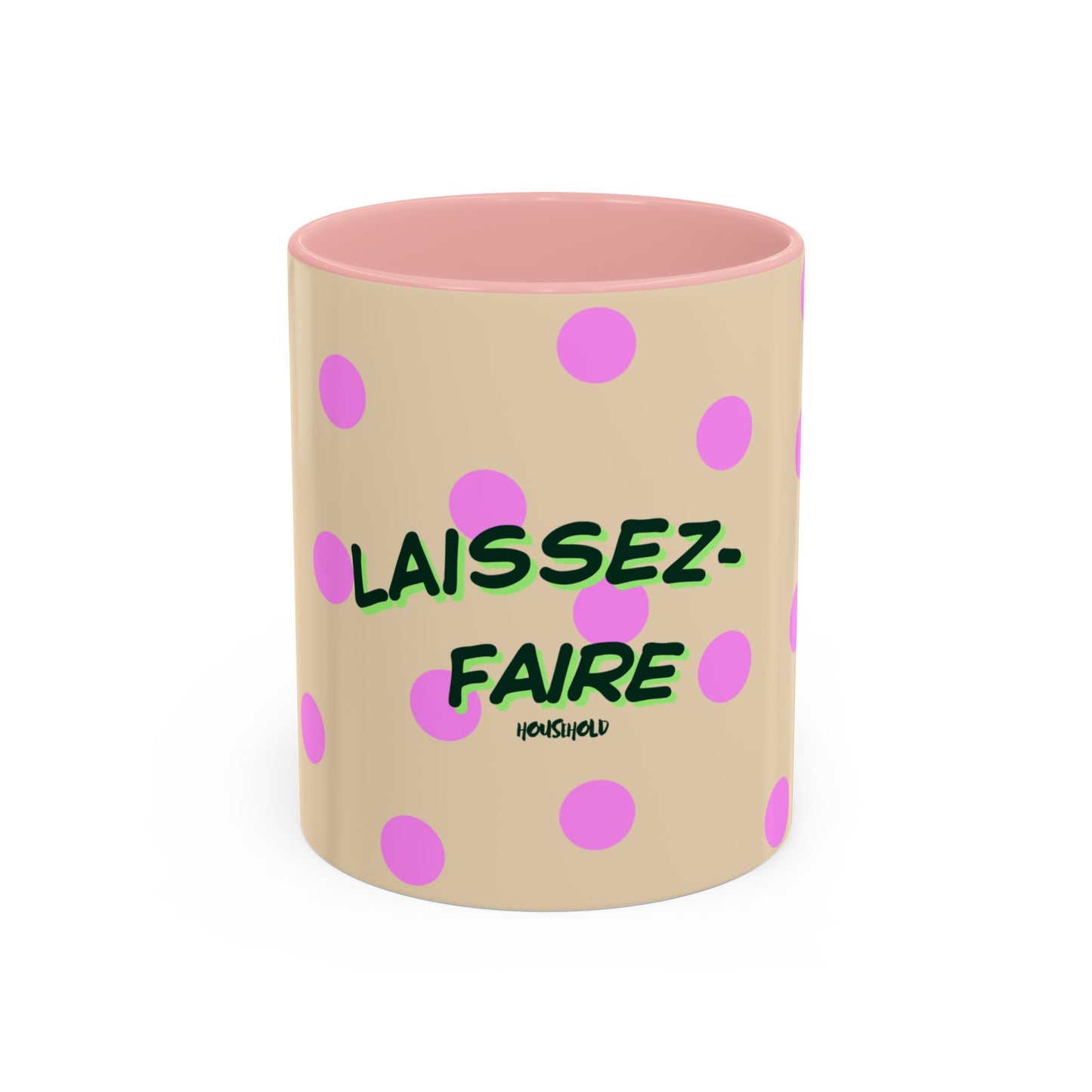 Beige mug with pink interior, polka dots, and green text on a white background