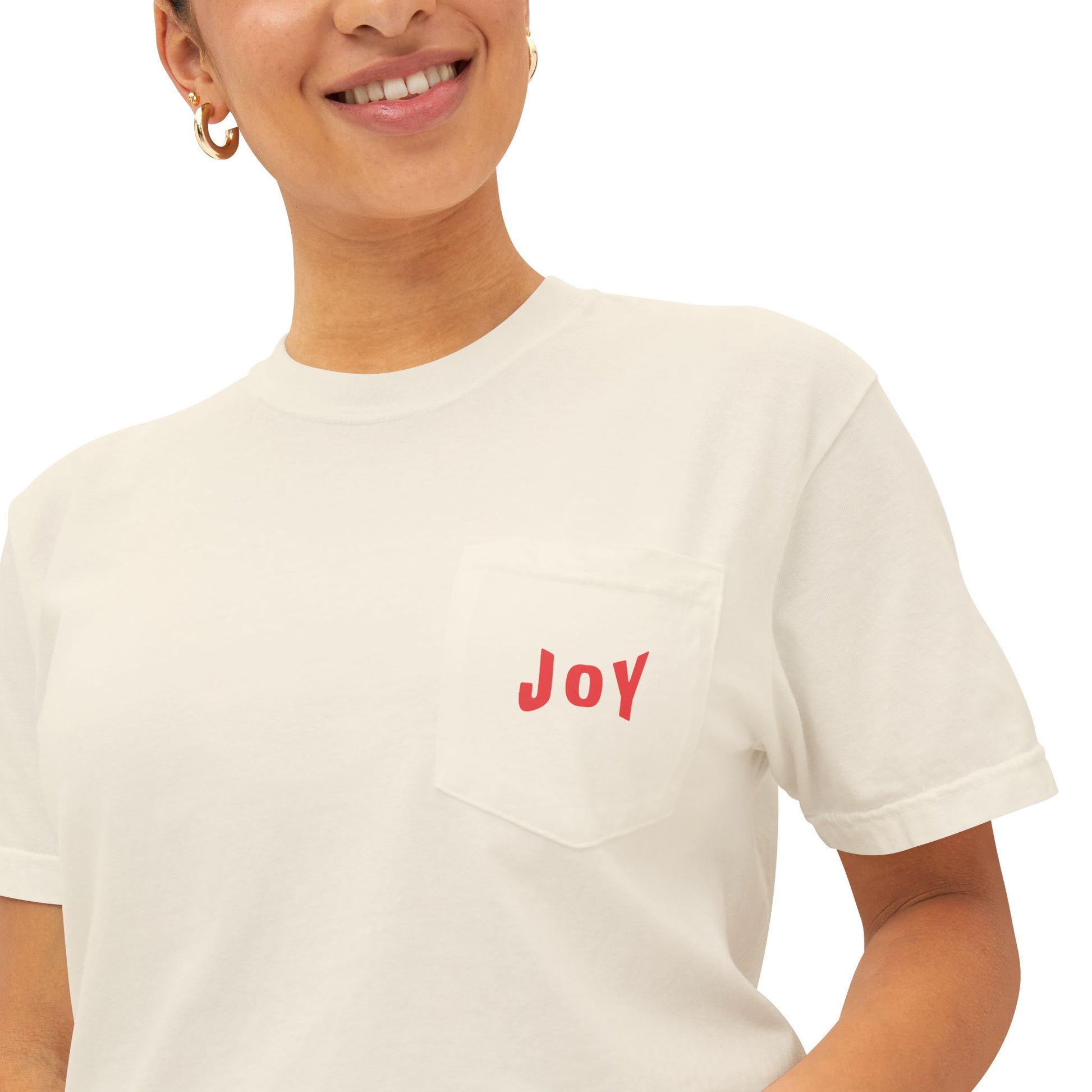 Person wearing a white t-shirt with 'JOY' printed in red on a white background