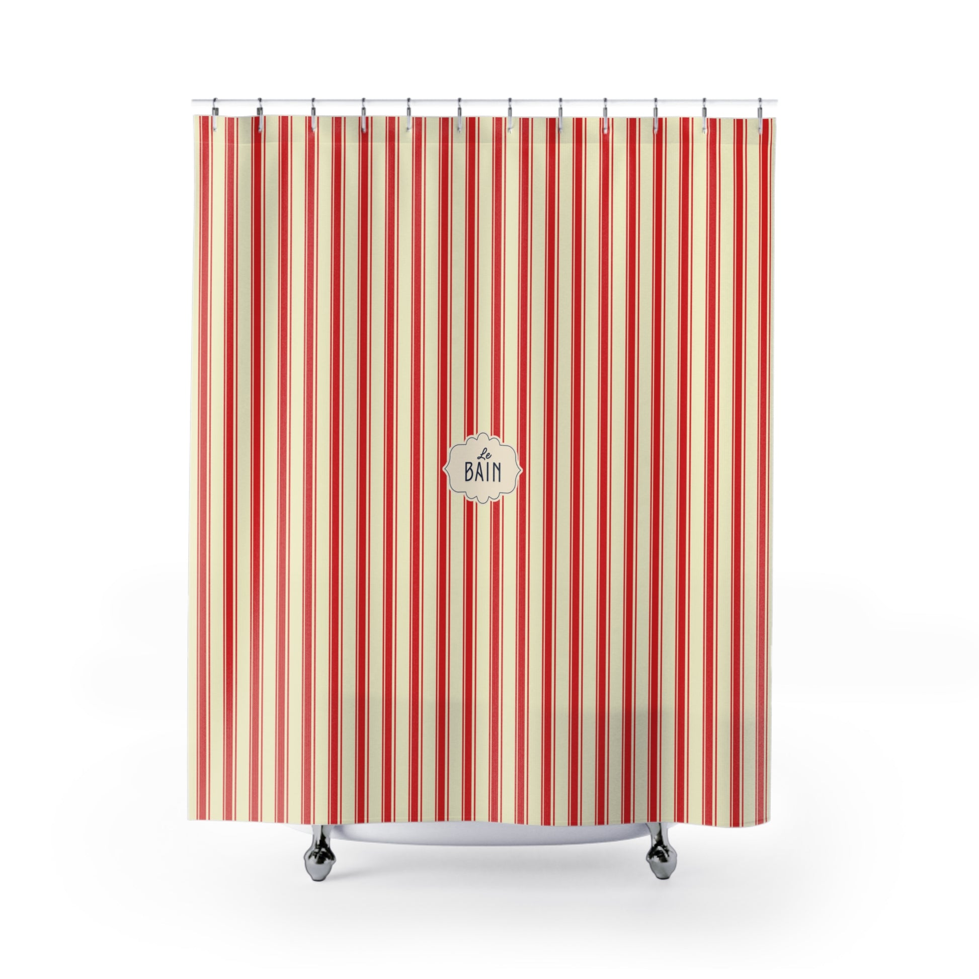 A striped shower curtain with vertical red, orange, and cream stripes, featuring a circular 'Le BATH' logo in the center. It is shown hanging from silver hooks over a white bathtub against a plain white background. 
