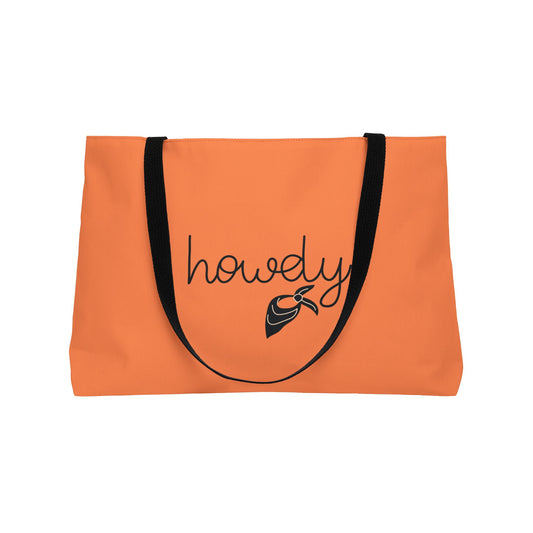 Orange tote bag with 'howdy' and fish graphic on a white background