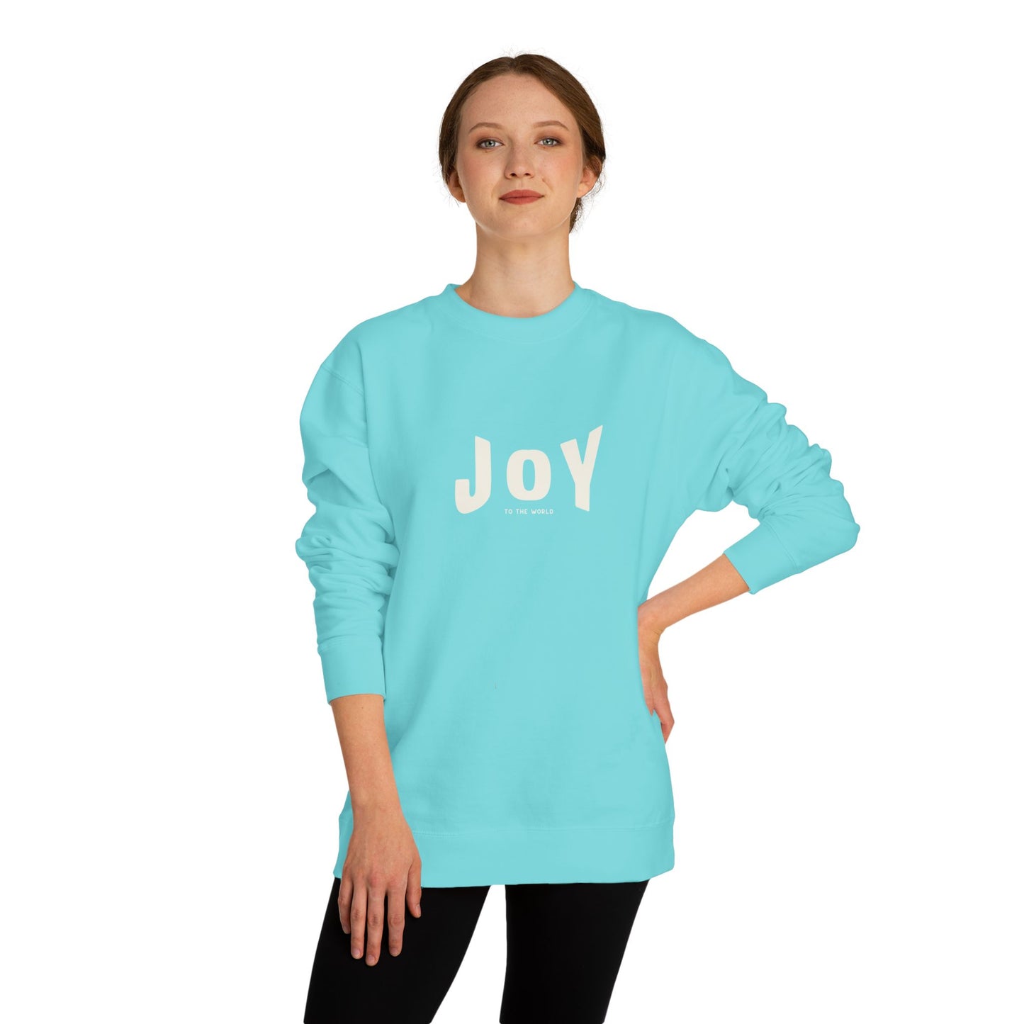 Person wearing a light blue sweatshirt with 'JOY' printed on it against a white background