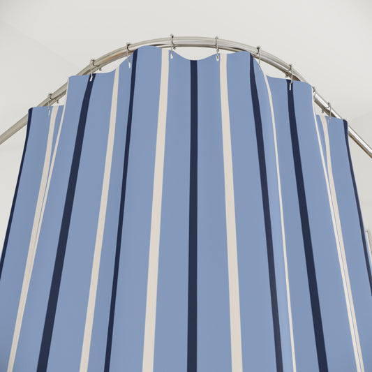 Blue and white striped shower curtain with a metal frame against a light gray background