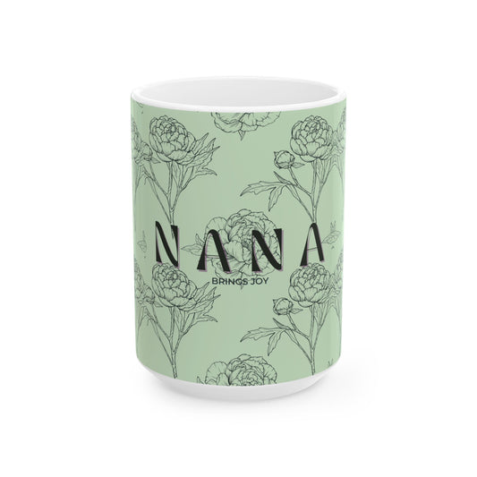 Mug with floral design and 'Nana Brings Joy' text on a light green background