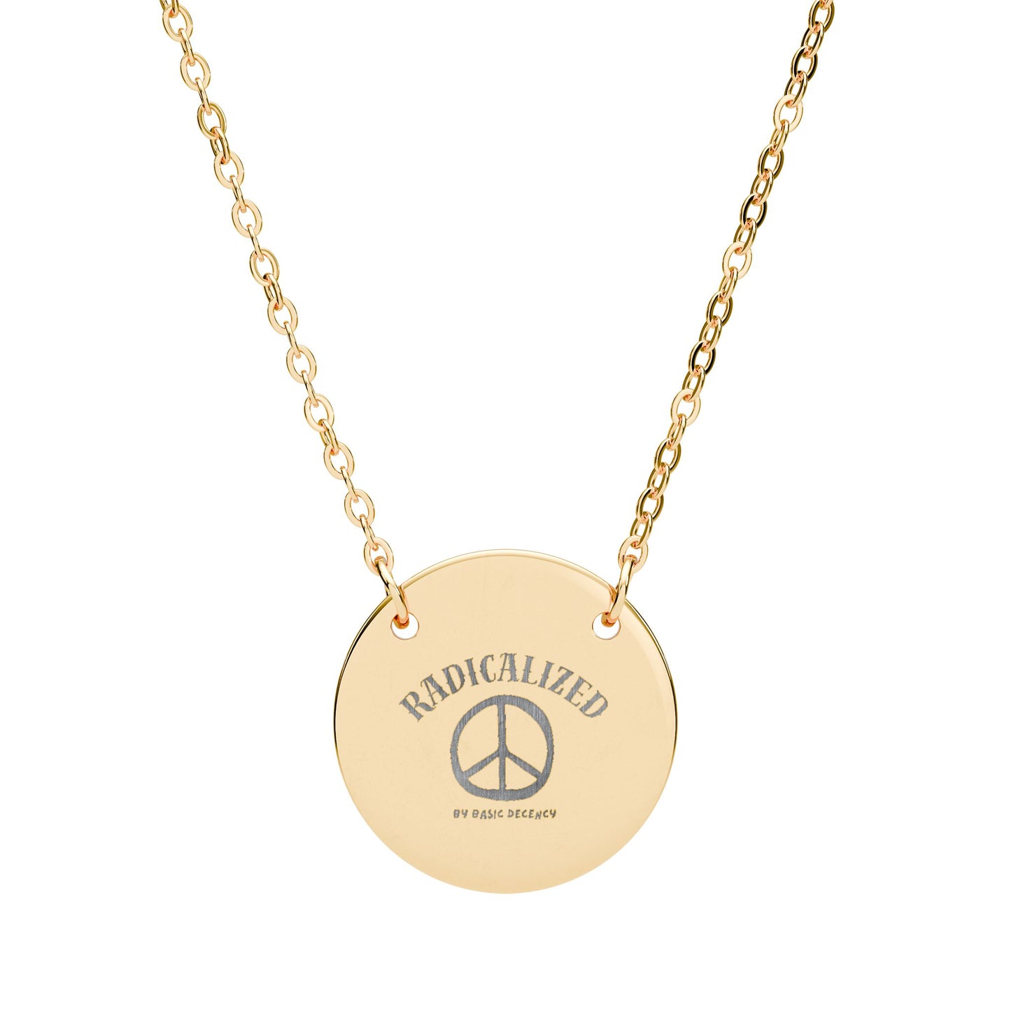 Gold necklace with a round pendant featuring 'RADICALIZED PEACE' text on a white background