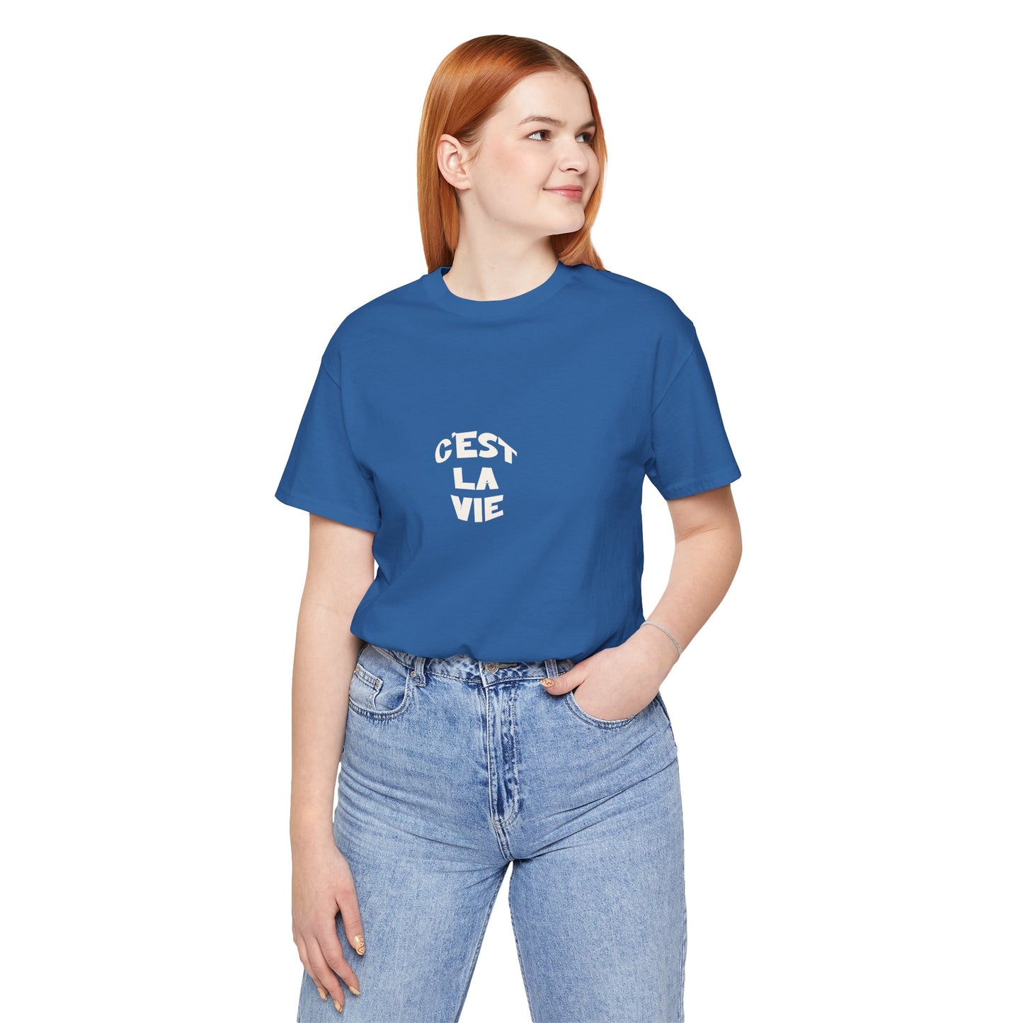 Person wearing a blue t-shirt with 'Cést La Vie' text on a white background
