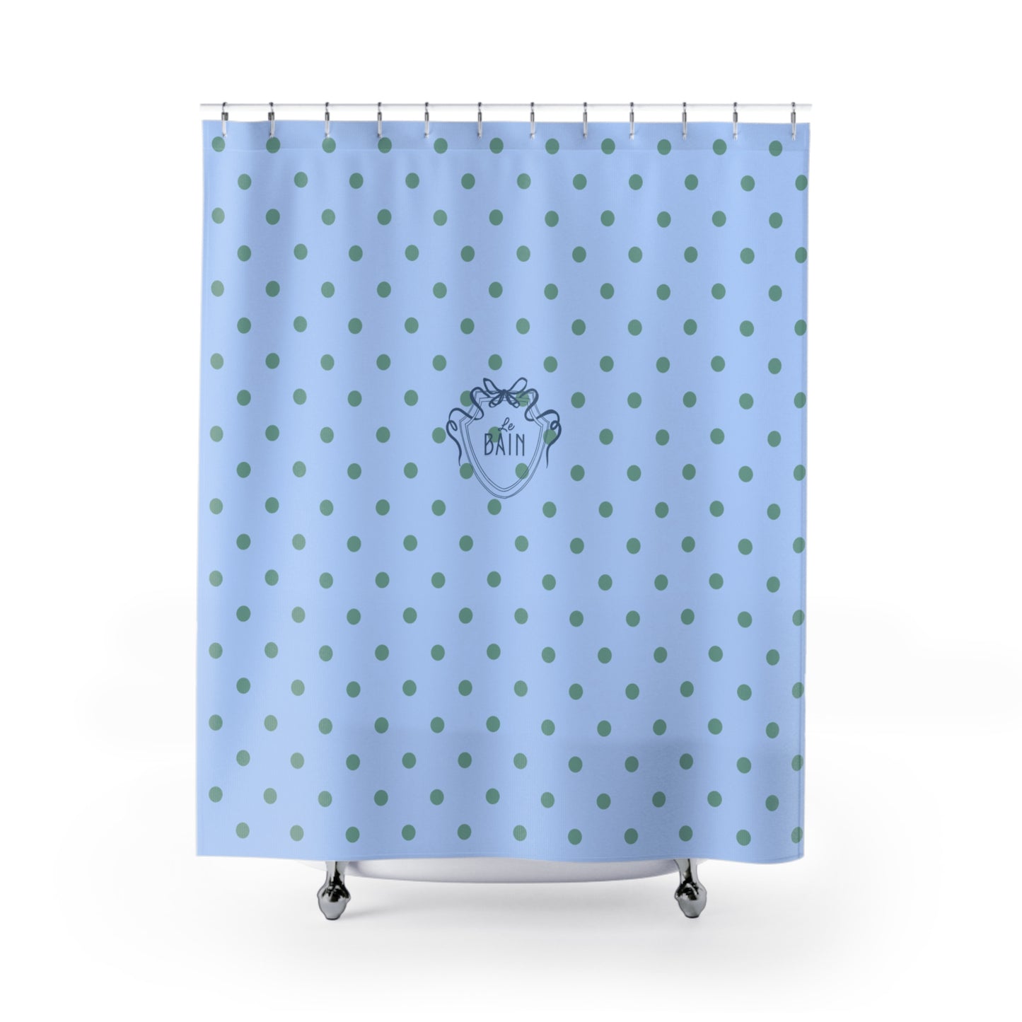Blue shower curtain with green polka dots and a logo on a white background