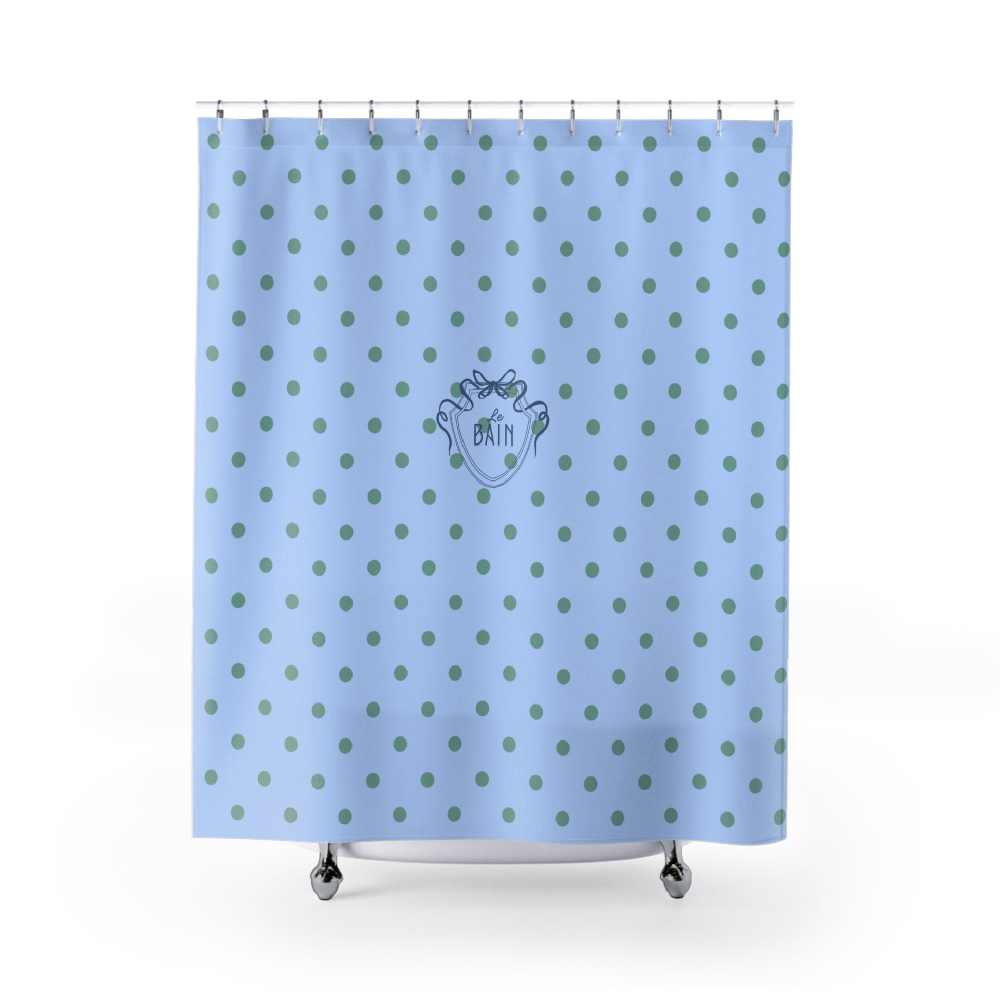 Blue shower curtain with green polka dots and a logo on a white background