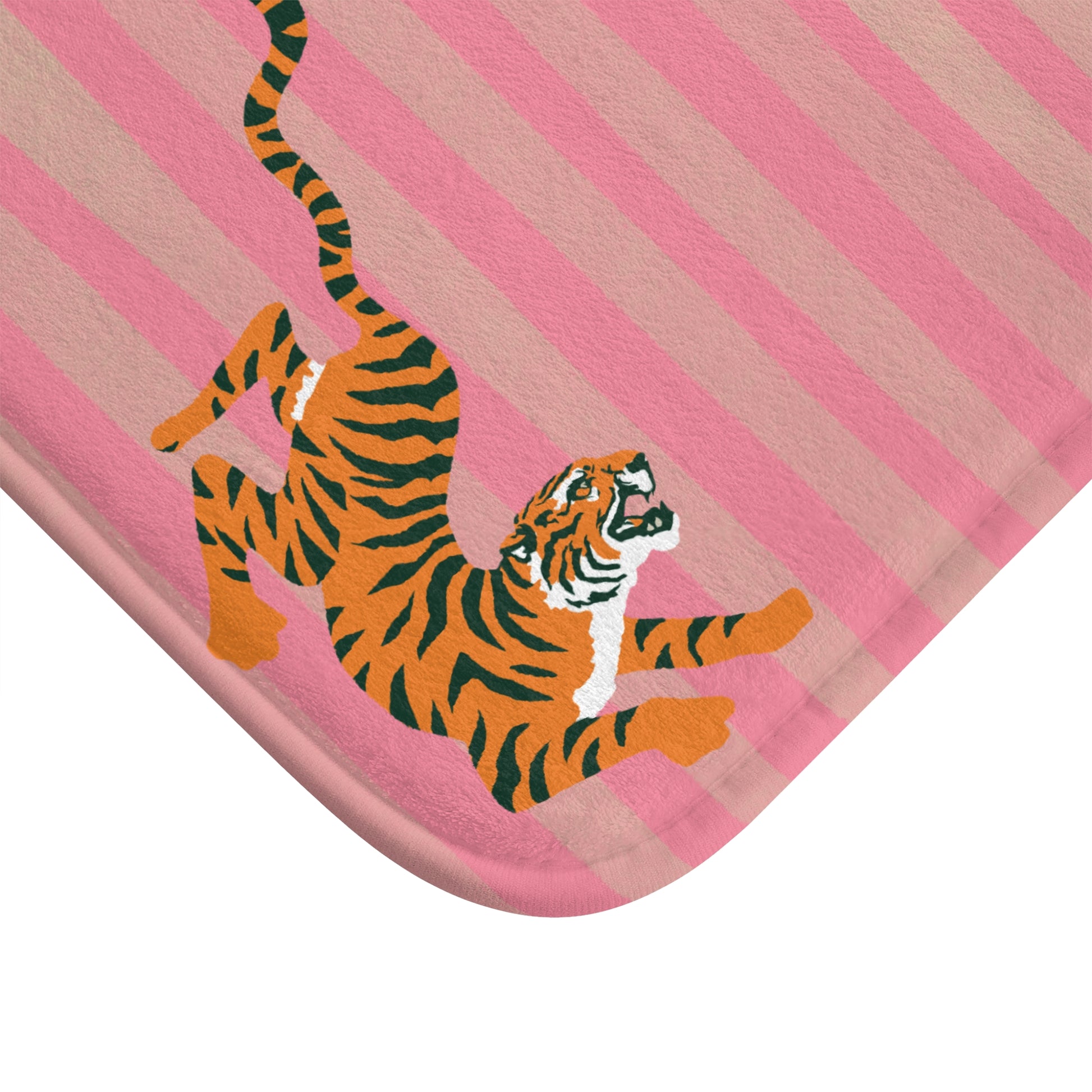 Pink baby blanket with a tiger design on a white background