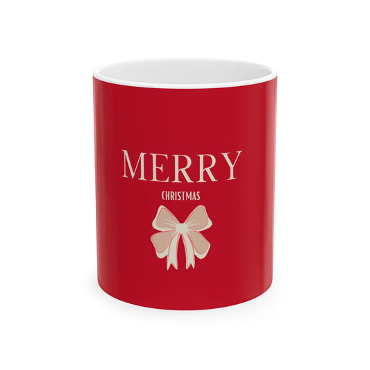 Red mug with 'Merry Christmas' text and a bow design on a white background