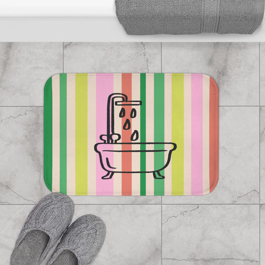 Striped bath mat with bathtub and shower design on a tiled floor.