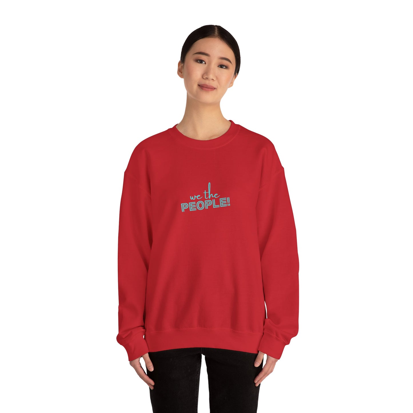 Person wearing a red sweatshirt with 'we the PEOPLE' text on a white background