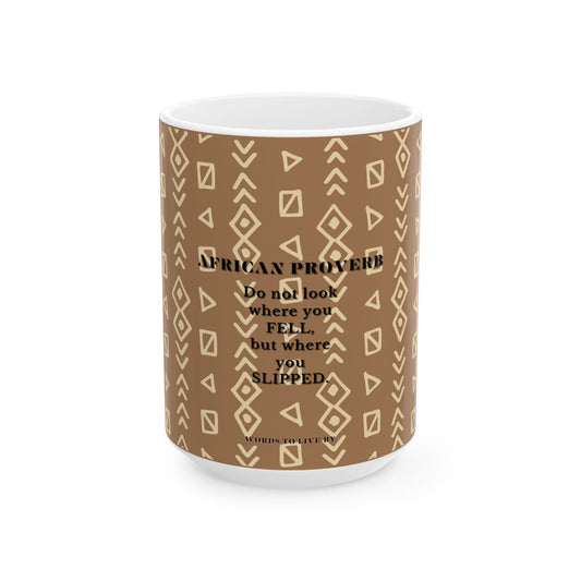 Mug with brown pattern and African proverb text on a white background