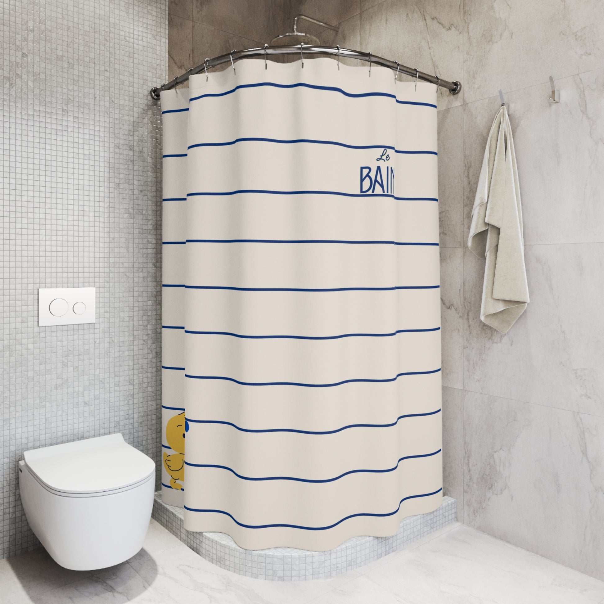 A shower curtain with horizontal blue stripes on an off-white background, featuring the text 'BAII' and a small yellow duck illustration, shown hanging in a modern tiled bathroom next to a toilet and towel.