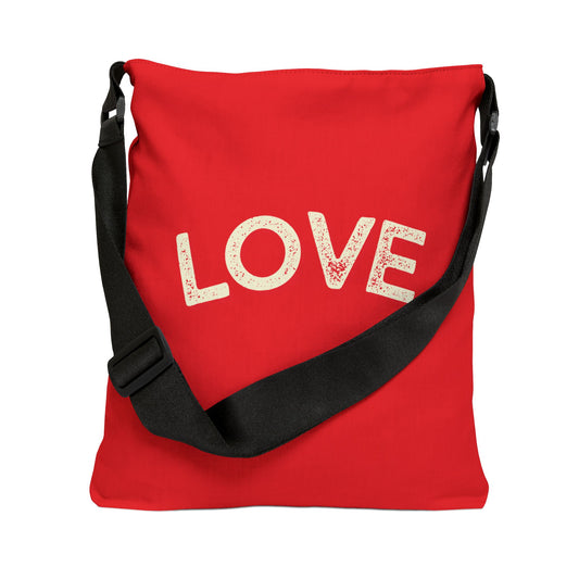 Red bag with 'LOVE' printed on it and a black strap against a white background