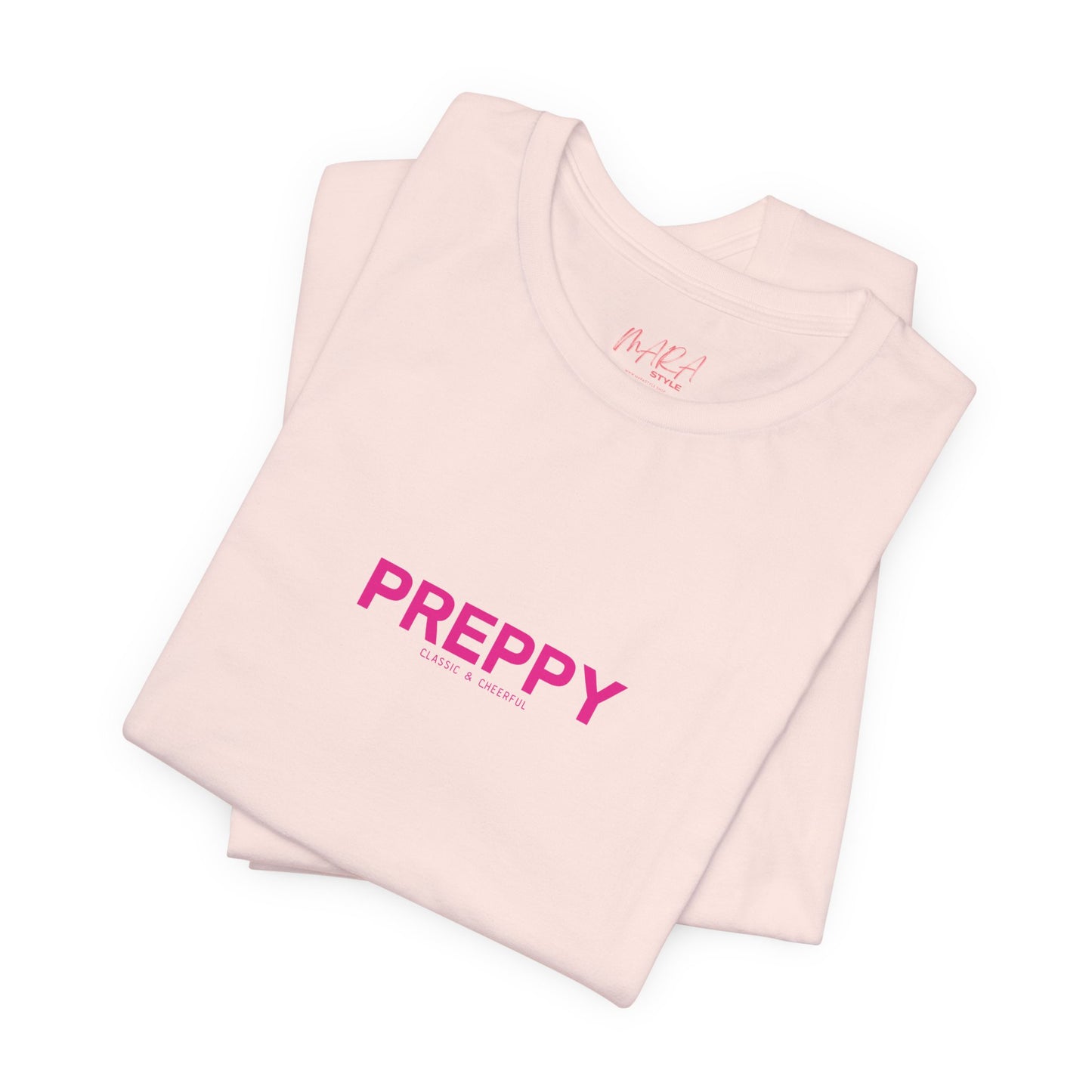 Folded pink sleeveless top with 'PREPPY' text on a white background