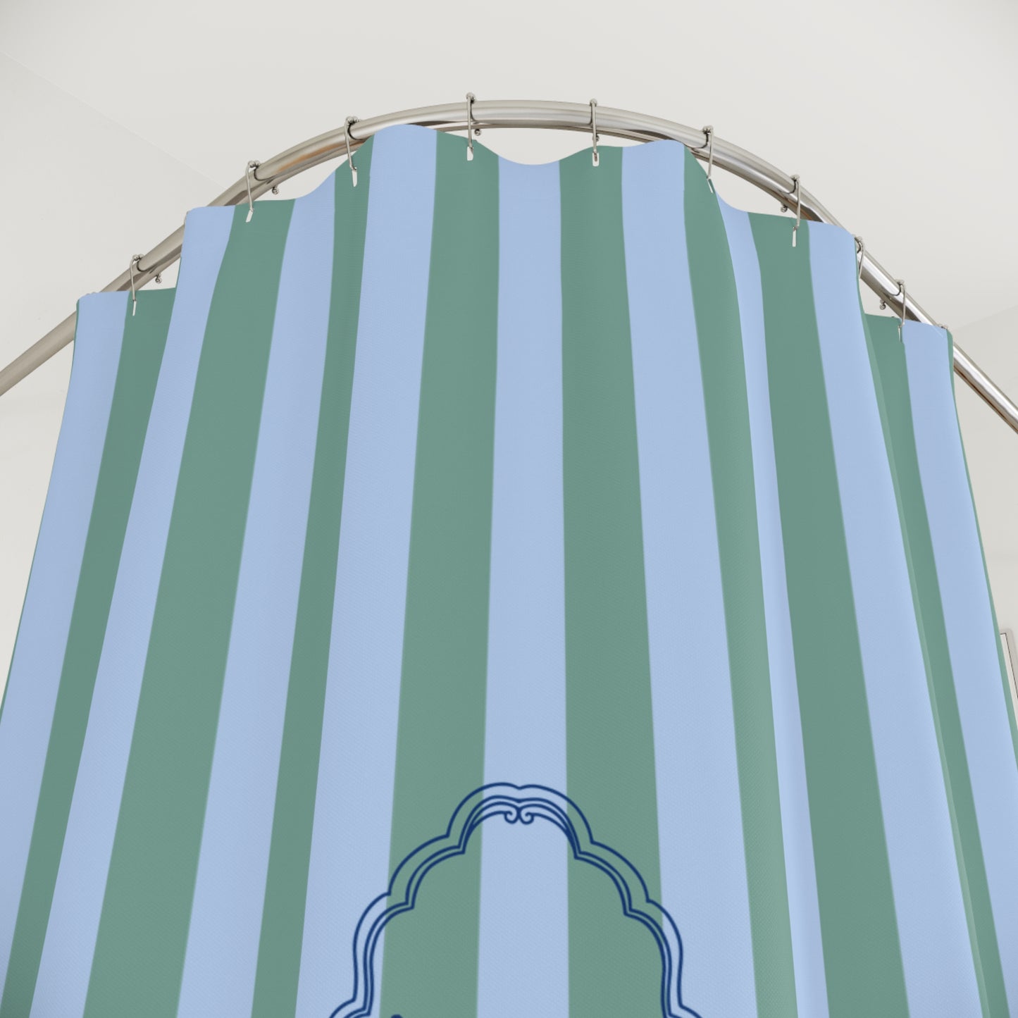 Striped green and blue curtain with a decorative emblem on a white background
