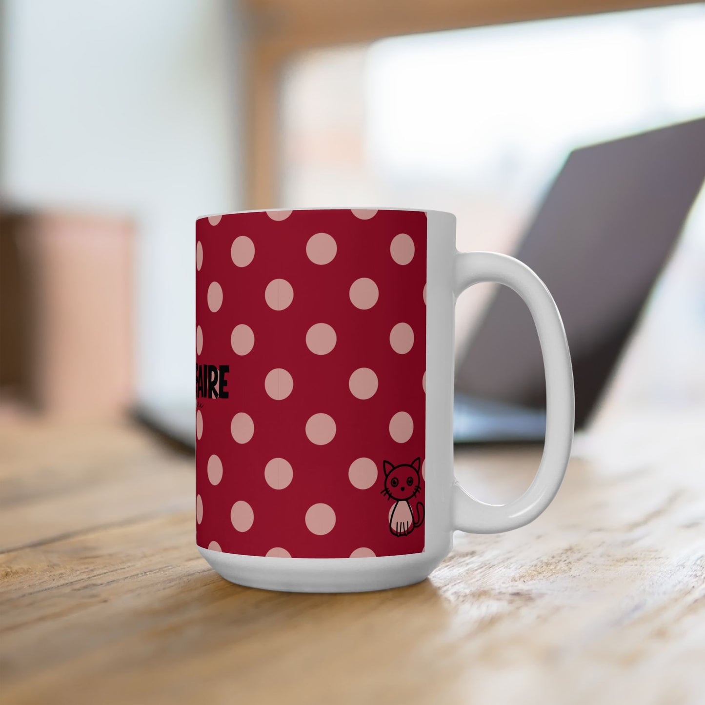 White mug with red polka dot pattern on a wooden surface