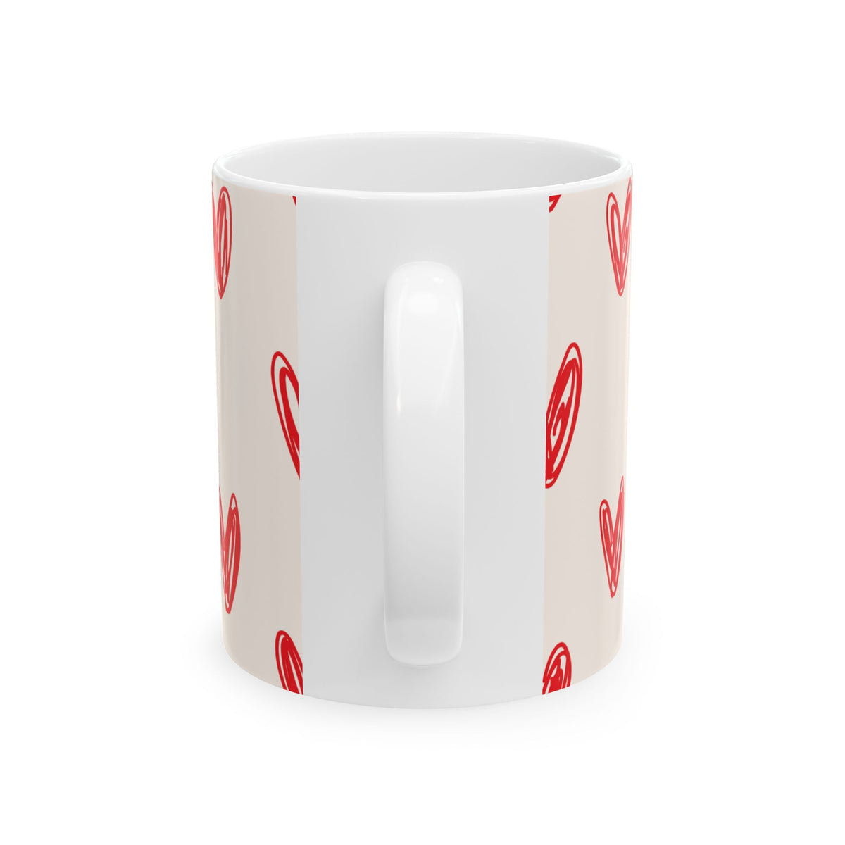 A white ceramic mug with a beige wrap-around print featuring a pattern of red hand-drawn hearts, shown on a clean white background.
