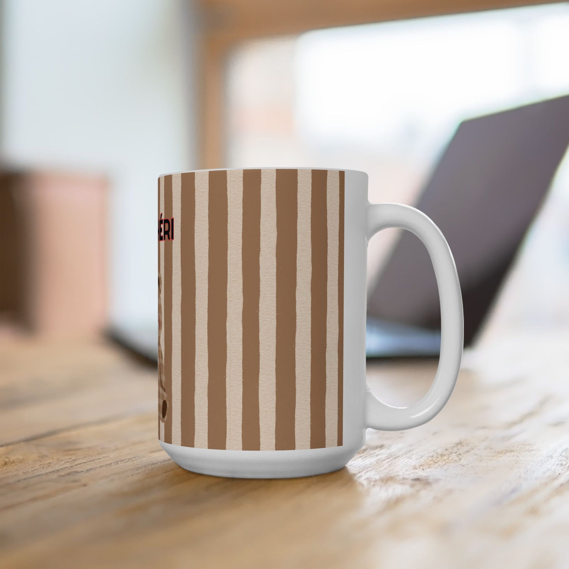 White mug with brown striped pattern on a wooden surface