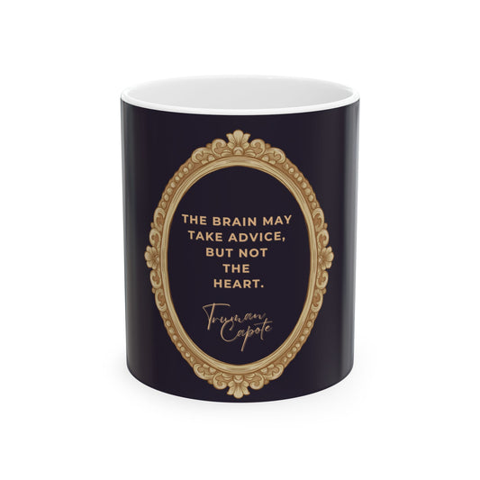 Navy mug with gold decorative frame and white interior, featuring a quote by Truman Capote.