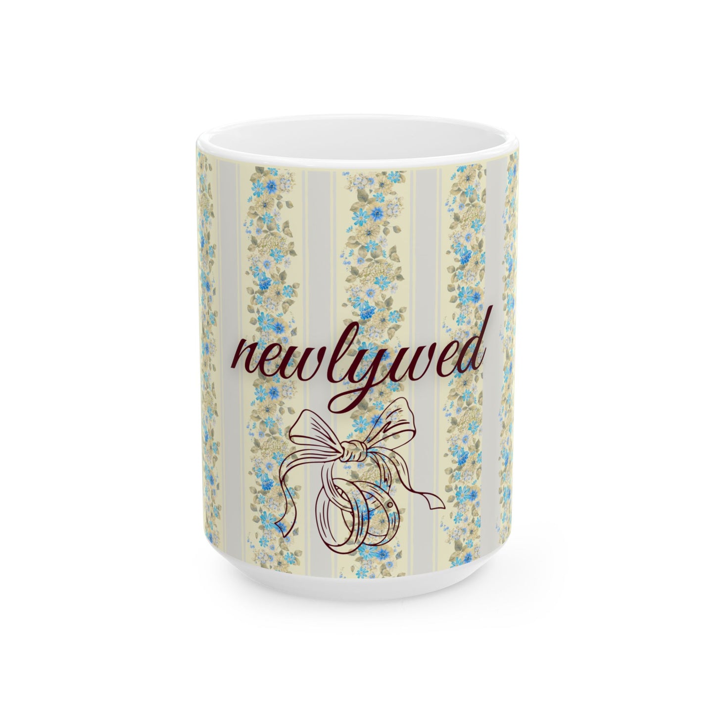 Mug with floral design and 'newlywed' text on a white background