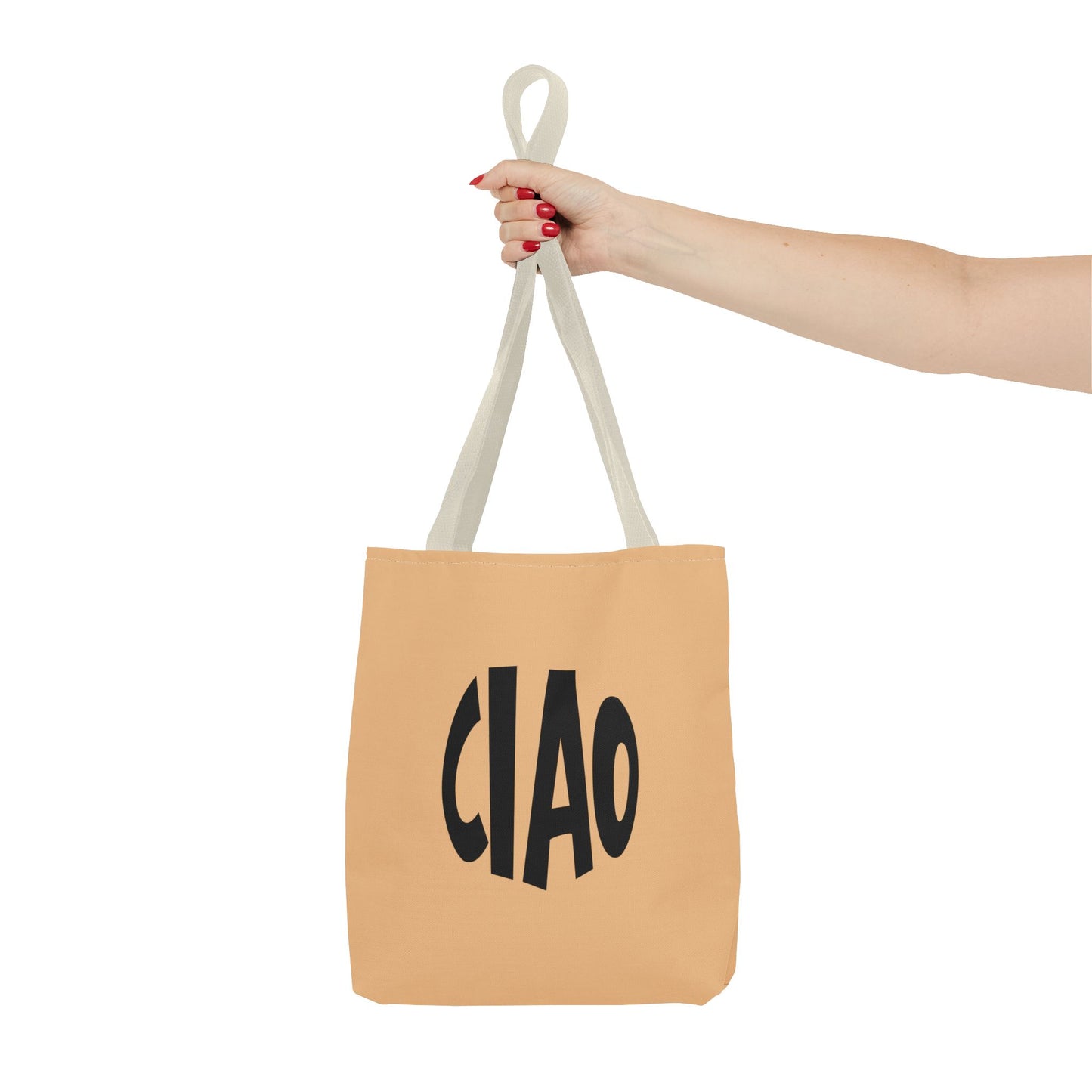 Beige tote bag with 'CIAO' text held by a hand on a white background