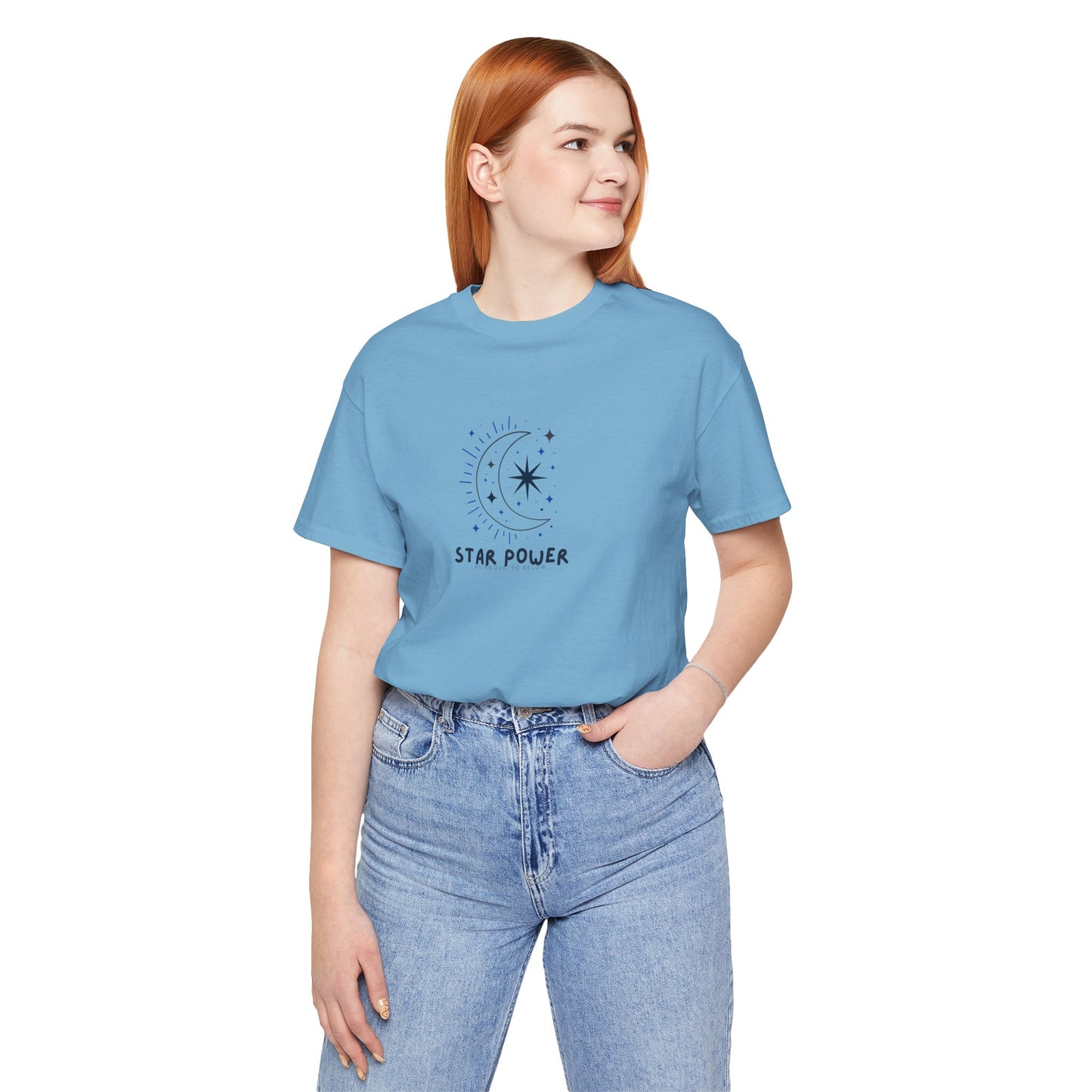 Person wearing a blue t-shirt with a graphic and text on a white background