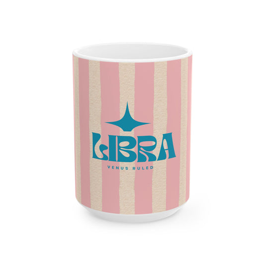 Mug with pink and beige striped design and Libra zodiac sign on a white background
